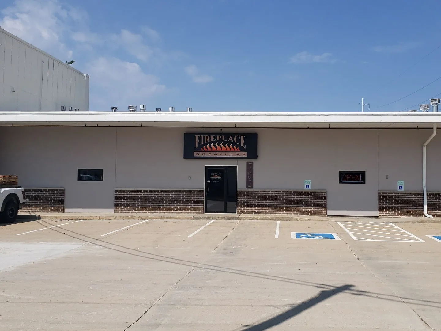 The Fireplace Creations storefront and parking lot on Ansborough Ave. in Waterloo, Iowa
